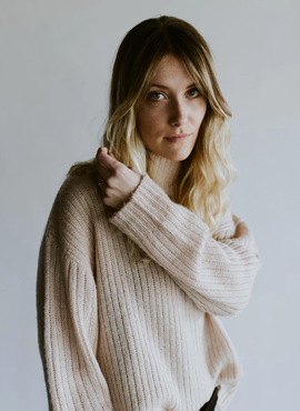 Woman in white sweater